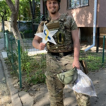 911 memorial star in Ukraine with a ukraine soldier.